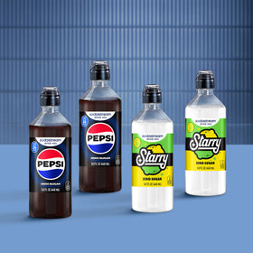 SodaStream Pepsi Starry Zero Sugar glass being filled from the pour bottle