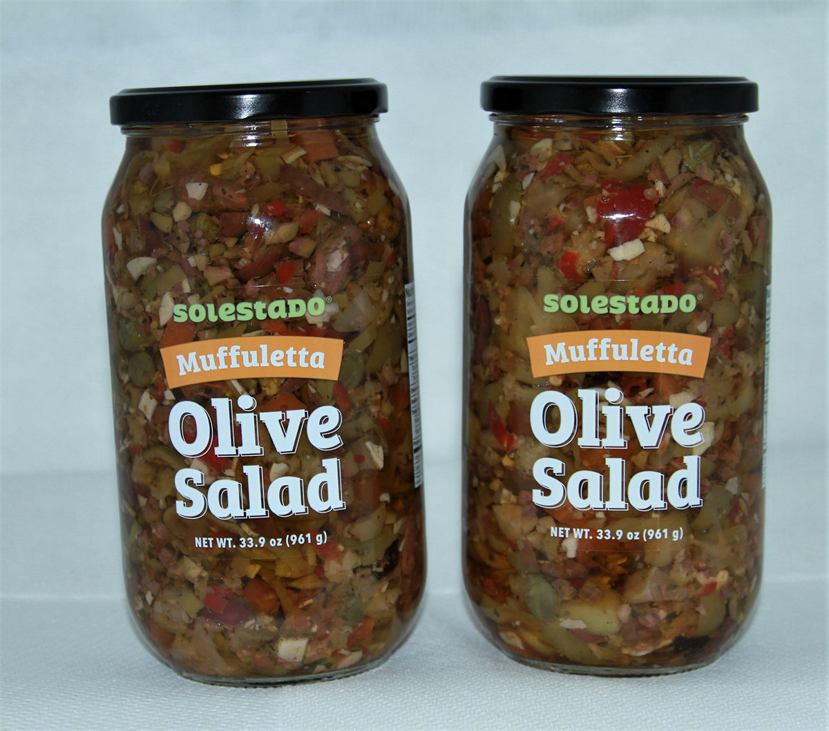 Solestado Muffuletta Olive Salad jar closeup—colorful vegetables ideal for sandwiches.