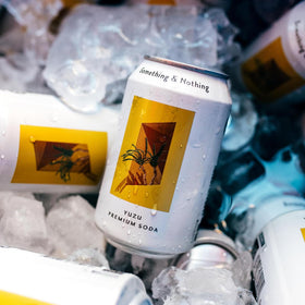 Something & Nothing Yuzu sparkling water on a table ready to enjoy
