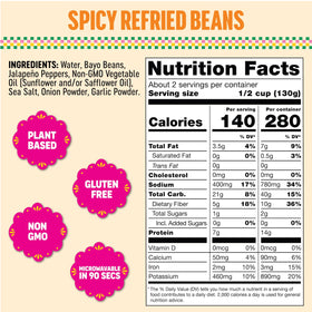 SOMOS spicy refried beans on a plate with tacos, ideal for quick weeknights.