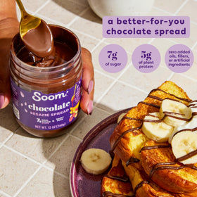 Soom Foods Chocolate Tahini Spread on spoon ready for a snack