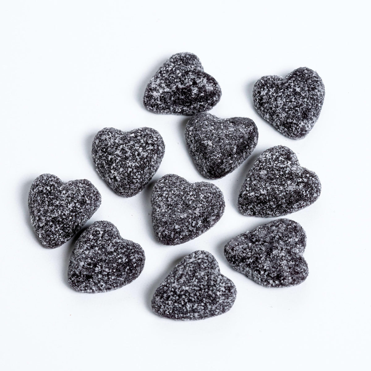 Sour Patch Kids Sour Hearts Black Raspberry candy closeup, chewy texture and fruity flavor.