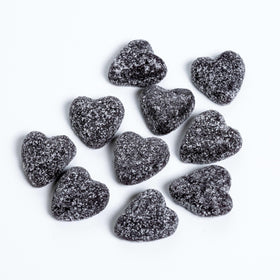 Sour Patch Kids Sour Hearts Black Raspberry candy closeup, chewy texture and fruity flavor.