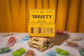Close-up of premium nuts in SOUTH FORTY SNACKS bars showing rich texture.