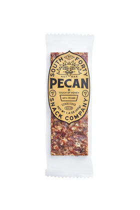 SOUTH FORTY SNACKS pecan bar bite-shot highlighting crunchy texture and real ingredients.