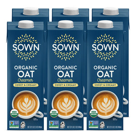SOWN Organic Oat Creamer Sweet & Creamy bottle pouring into coffee for a smooth dairy-free boost