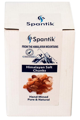 Spantik Himalayan salt chunks arranged in a candle jar centerpiece for ambiance.