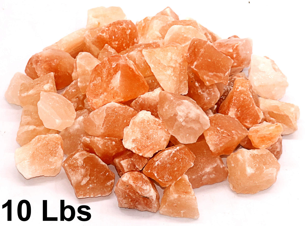 Spantik Himalayan salt chunks in a rustic display emphasizing mineral texture.