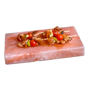 Spantik salt block plate on stovetop searing steak with mineral heat
