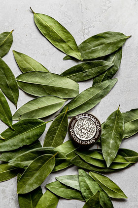 Spice Islands bay leaf dried leaves close-up highlights texture for soups and sauces.