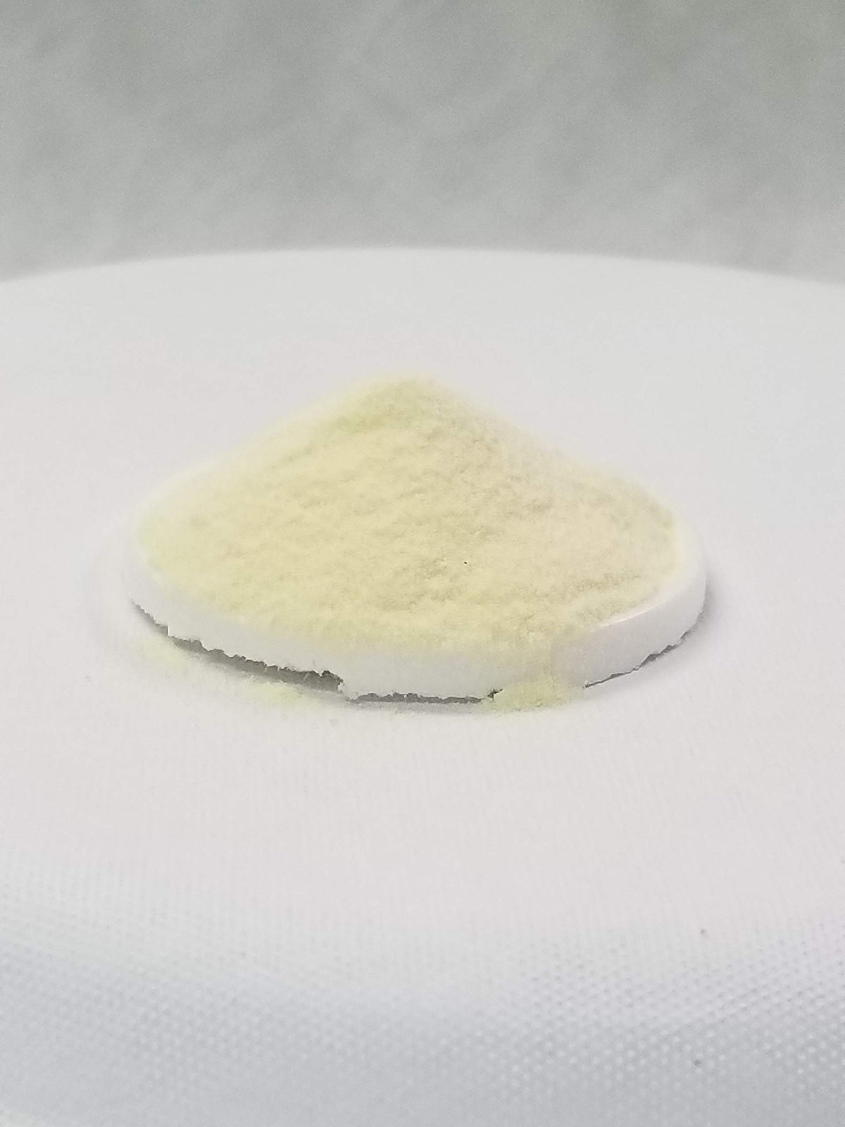 SpiceMasters Dough Enhancer with donuts cooling on a rack for improved texture