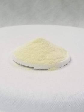 SpiceMasters Dough Enhancer with donuts cooling on a rack for improved texture