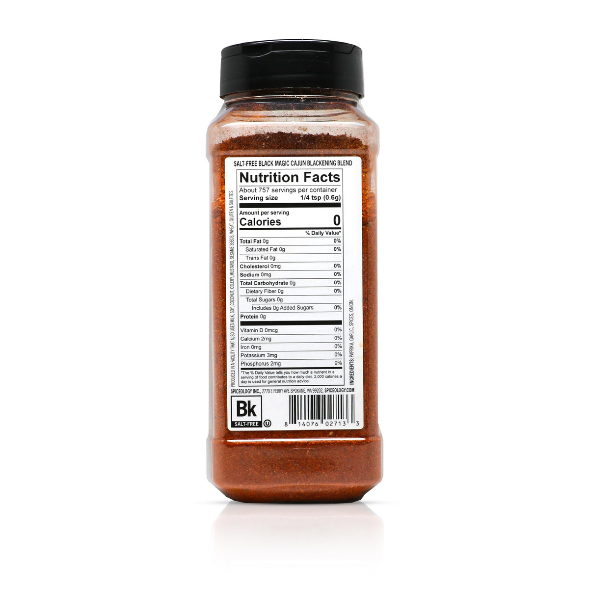 Grill scene with Spiceology Black Magic on food, showcasing smoky Cajun depth