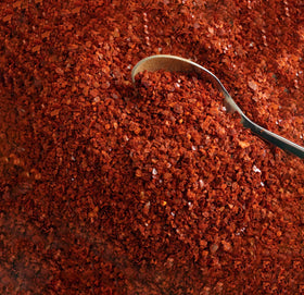 Closeup of Spiceology Gochugaru packaging highlighting pure flakes with no salt or fillers.