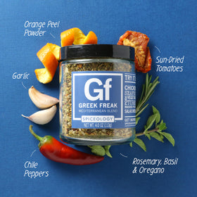 Spiceology Greek Freak dry rub being sprinkled for a quick flavor boost on meats.