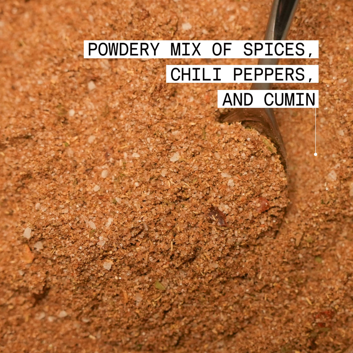 Jamaican Jerk Rub on grill pan during a smoky outdoor cook.