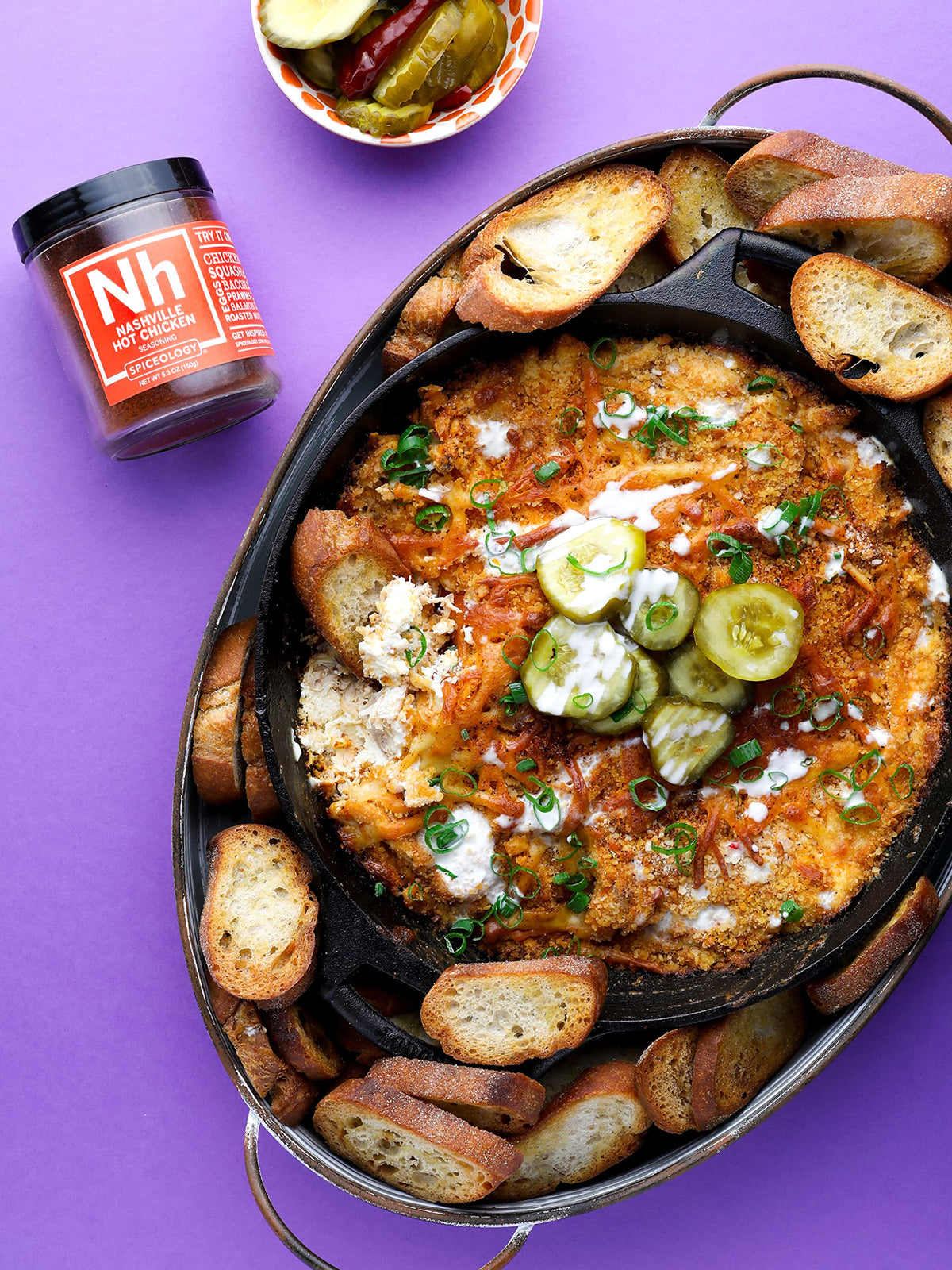 Spiceology Nashville Hot sauce base enriched with seasoning for depth.