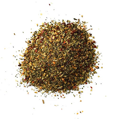 Spiceology Pizza Seasoning pouring jar ready for quick seasoning during cooking.