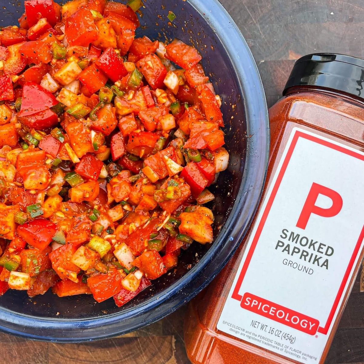 Spiceology Smoked Paprika Powder on a spoon ready to season vegetables.