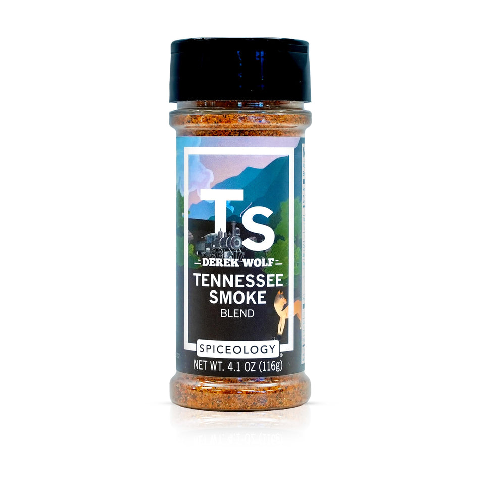 Spiceology Tennessee Smoke BBQ rub bottle label visible, enhances beef flavor for grilling.