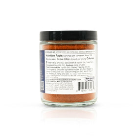 Spiceology Tomatador shaker dispensing seasoning for quick weeknight flavor.
