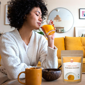 SPICY ORGANIC turmeric powder bottle being poured for everyday use