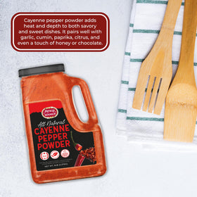 Label close-up of Spicy World cayenne powder showing gluten-free, all-natural ingredients