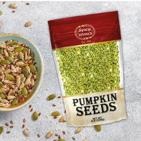 Spicy World pumpkin seeds on salad top for added crunch.
