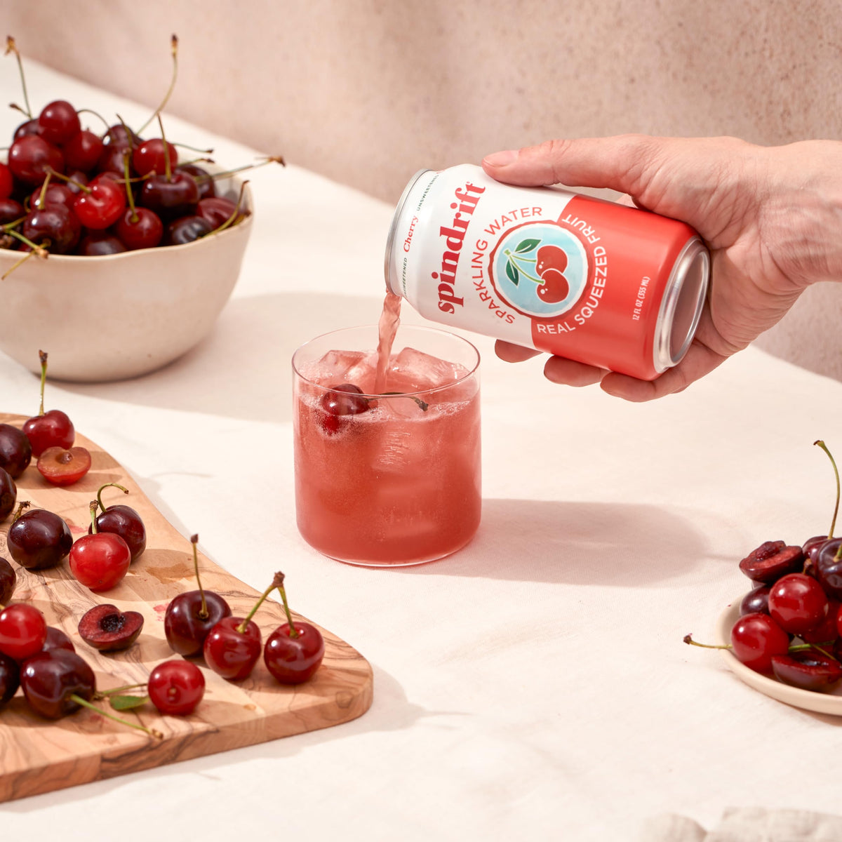 Chilled Spindrift Cherry poured into a glass highlights crisp, lightly carbonated refreshment.