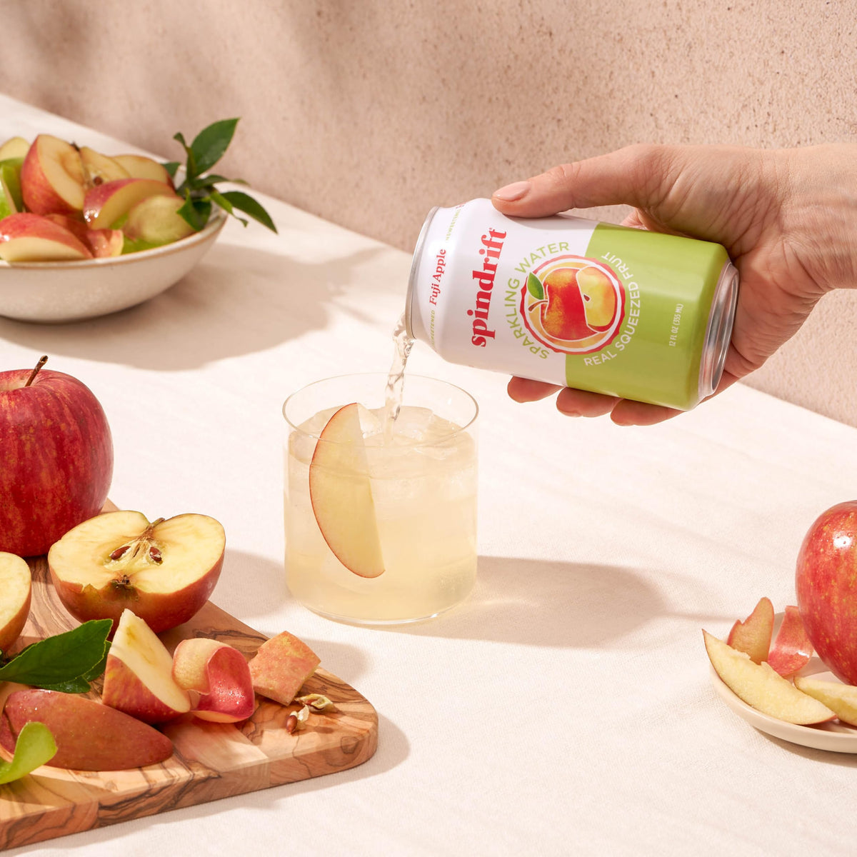 Spindrift Fuji Apple can on shelf highlighting no sugar added option.