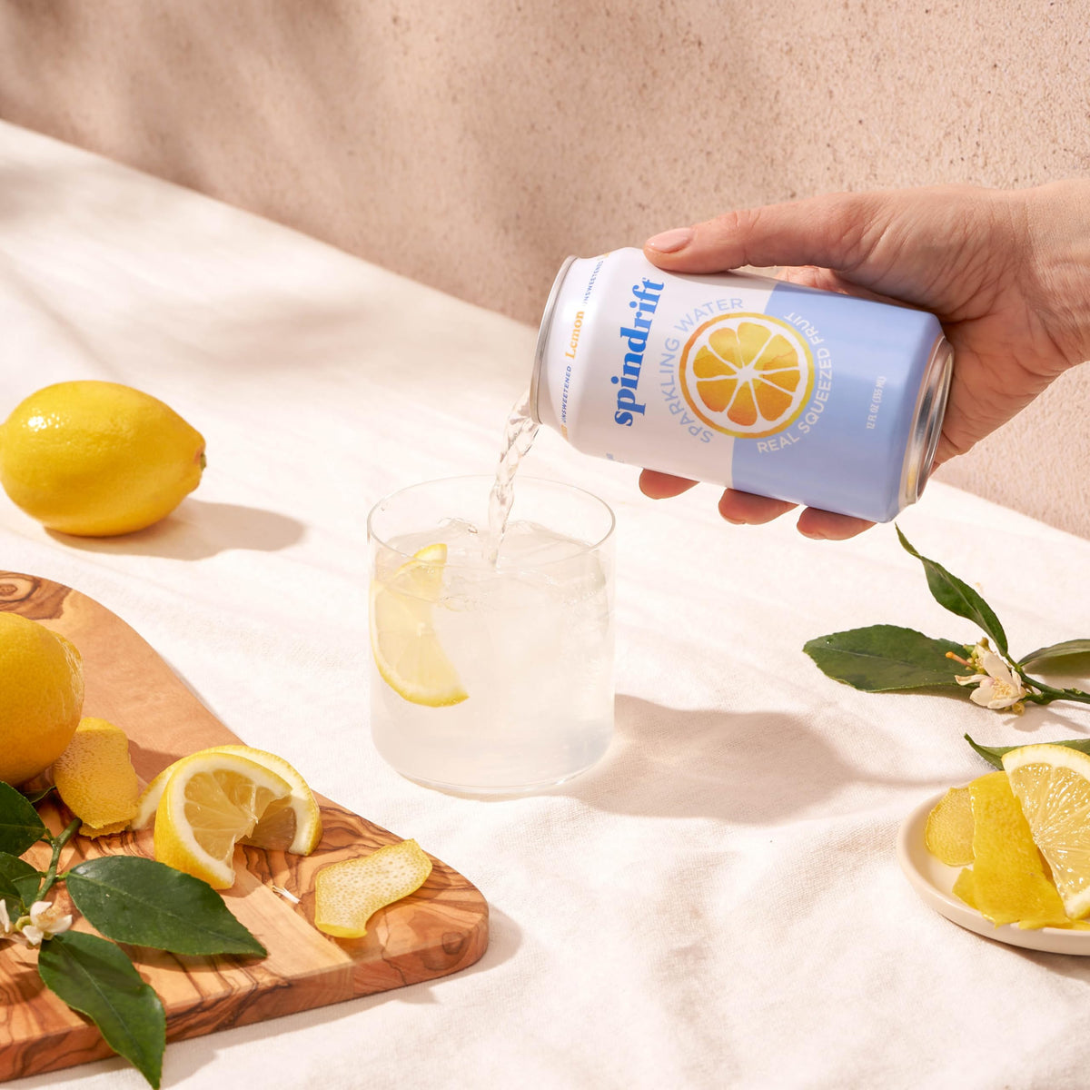 Spindrift Lemon glass sip illustrates lightly carbonated, pulpy texture for fuller flavor.