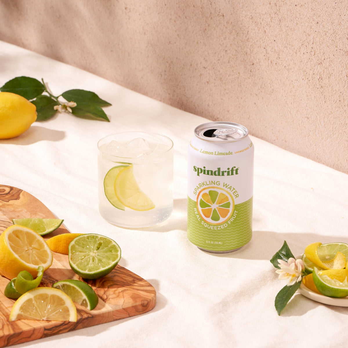 Spindrift Lemon Limeade glass with lime wedge ready to pour
