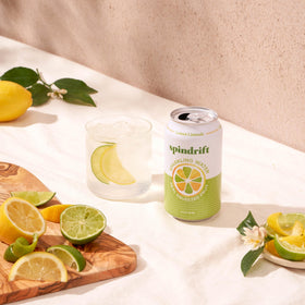 Spindrift Lemon Limeade glass with lime wedge ready to pour