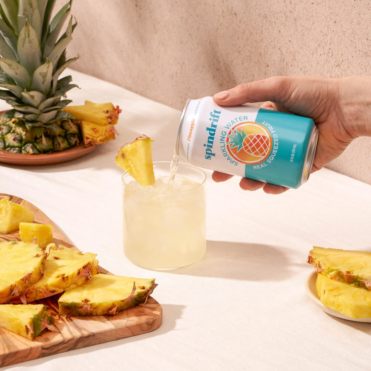 Spindrift Pineapple being poured into a glass for refreshing serve