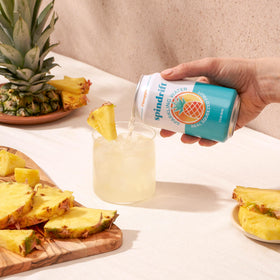 Spindrift Pineapple being poured into a glass for refreshing serve