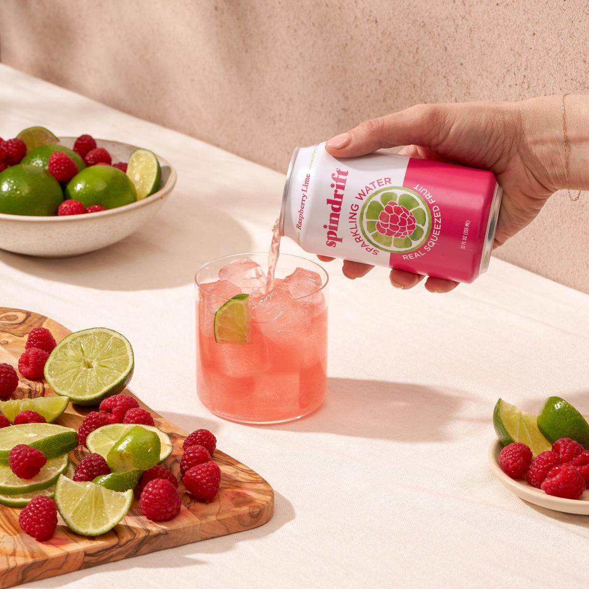 Spindrift Raspberry Lime glass with ice ready to sip