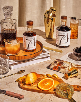 Spiritless Kentucky 74 on a wooden bar reflects warm Kentucky craft.