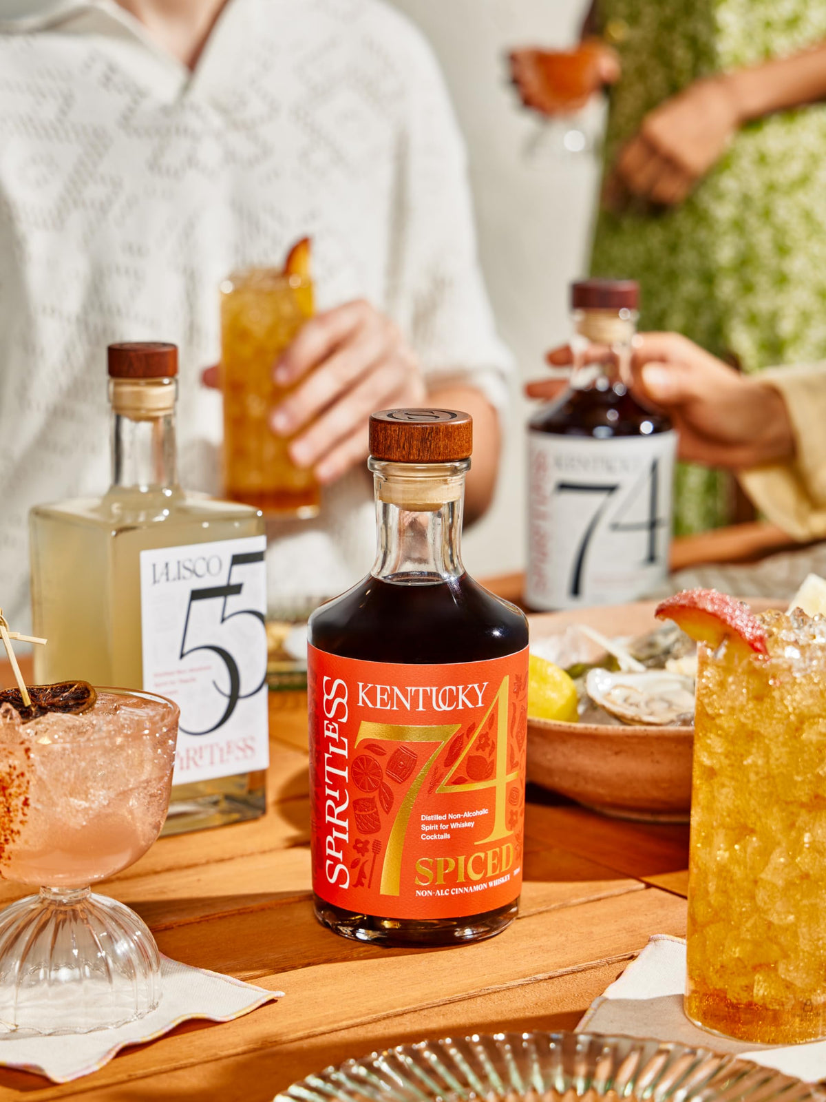 Spiritless Kentucky 74 Spiced being poured into glass for a non-alcoholic mix.
