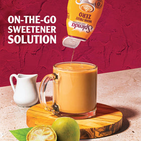 SPLENDA Monk Fruit Liquid Drops two-pack on kitchen shelf for everyday sweetness.