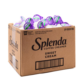 Splenda single-serve creamer cups on the counter for sugar-free daily coffee