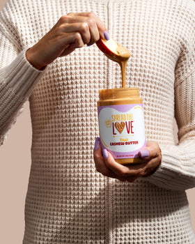 Creamy Spread The Love cashew butter stirred into smoothies for creamy thickness.