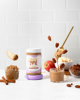 Healthy snack setup with Spread The Love and fruits.