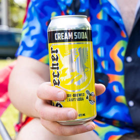 Pouring Sprecher Cream Soda over ice for cool refreshment