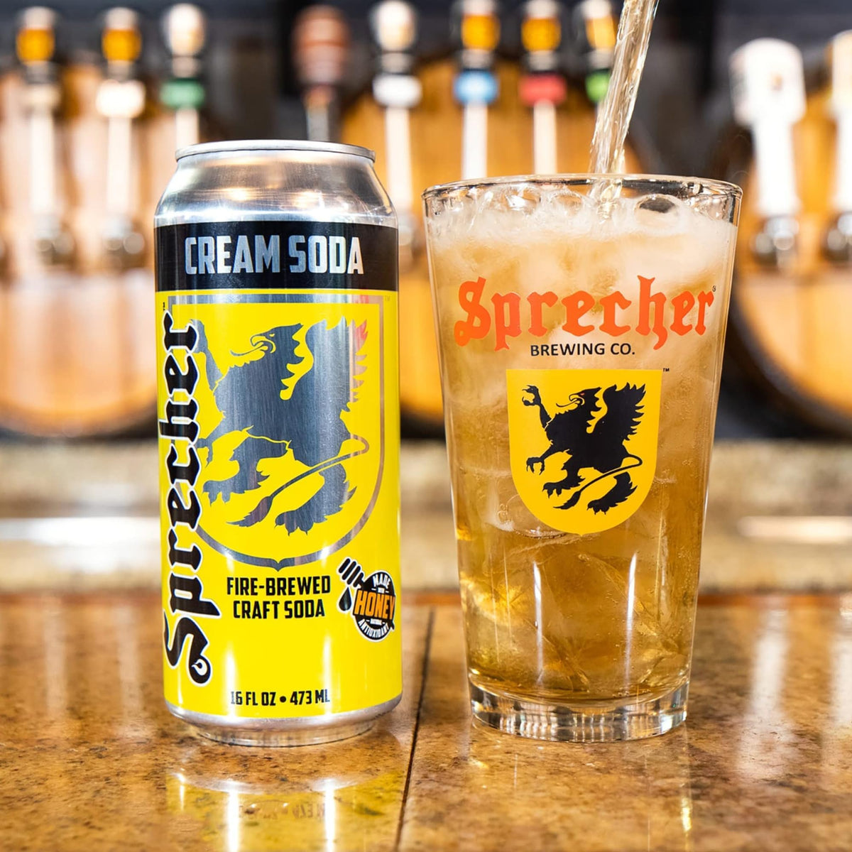 Sprecher fire-brewed soda kettle pour showing rich caramel depth