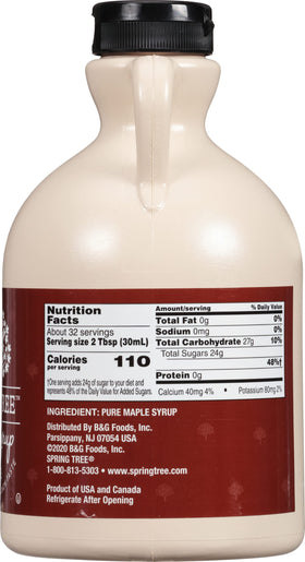 Close-up of Spring Tree syrup bottle showing amber color and grade A branding.