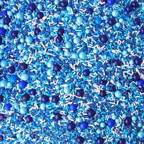 Sprinkle Pop Blue Ombre sprinkles enhance cupcakes with color and texture.