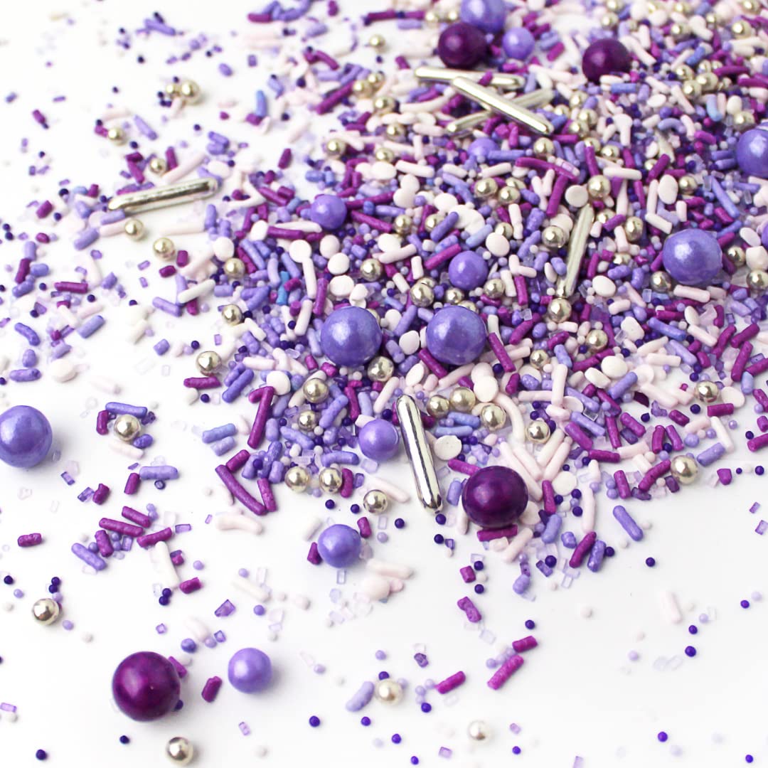 Sprinkle Pop Valentine’s Day dessert table theme in purple tones appeals to romance.
