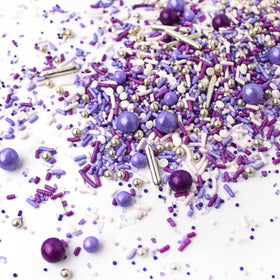 Sprinkle Pop Valentine’s Day dessert table theme in purple tones appeals to romance.