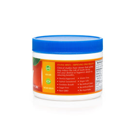 Spry Xylitol Cinnamon Mints close-up texture—smooth, cinnamon-scented mint.