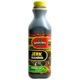 Spur Tree Jamaican Jerk Seasoning bottle on counter for authentic island flavor.